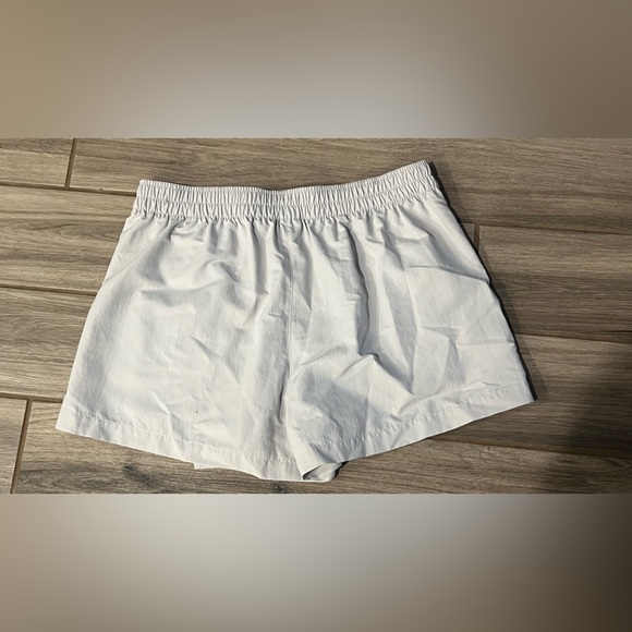 Nike Women's Sportswear Essential Mid-Rise Woven Skort - Picture 5 of 6